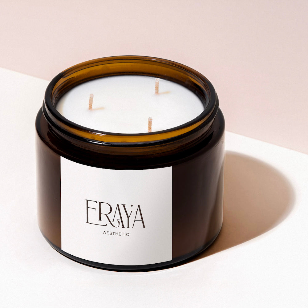 Eraya Aesthetic Candle in a brown jar with a Eraya Aesthetic logo label on a light background