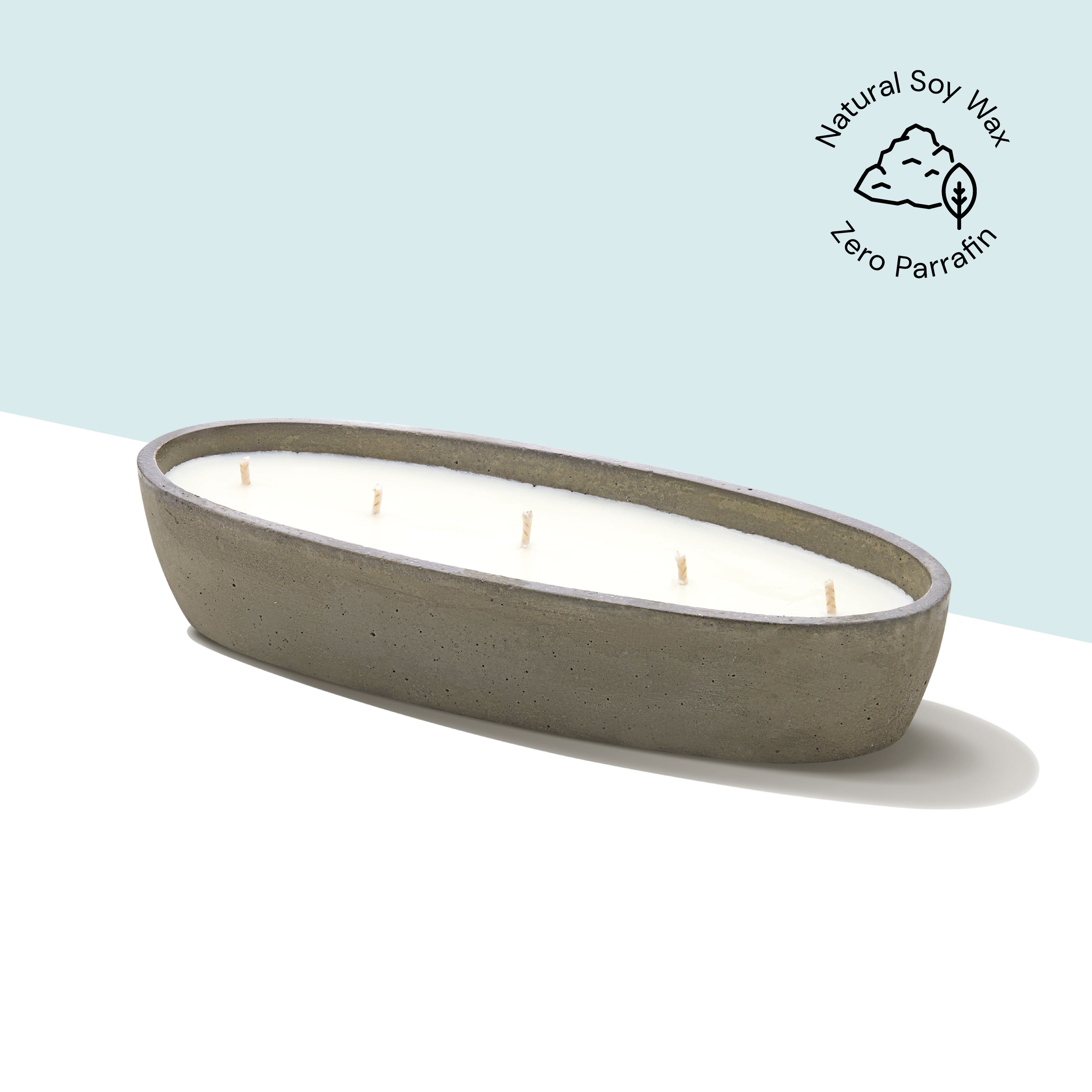 Oval-shaped 5 wicks Eraya Aesthetic candle with a natural soy wax label on a light blue background